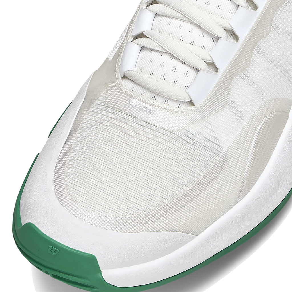 Wilson Intrigue Tour Women's Padel Shoes — White / Bosphorus; Cropped front three-quarter close-up showing the toe box, lacing and green toe bumper.