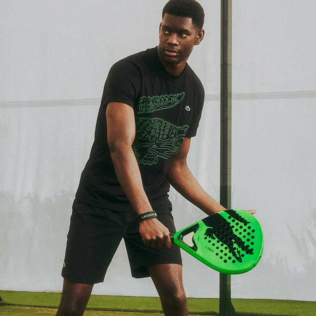 Lacoste L-Soft green and black padel racket, lifestyle view