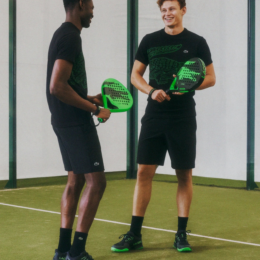Lacoste L-Soft green and black padel racket, on-court lifestyle view